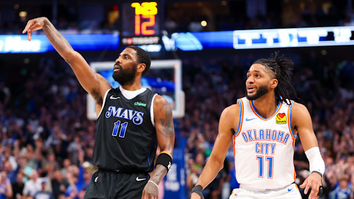 May 18, 2024; Dallas, Texas, USA;  Dallas Mavericks guard Kyrie Irving (11) shoots past Oklahoma City Thunder guard Isaiah Joe (11) during the second half in game six of the second round of the 2024 NBA playoffs at American Airlines Center. Mandatory Credit: Kevin Jairaj-Imagn Images