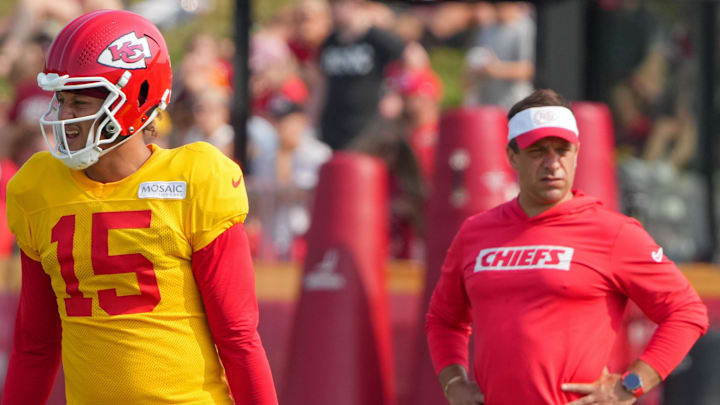 Jul 26, 2024; Kansas City, MO, USA; Kansas City Chiefs quarterback Patrick Mahomes (15) steps to the line as general manager Brett Veach watches in the background during training camp at Missouri Western State University. Mandatory Credit: Denny Medley-Imagn Images