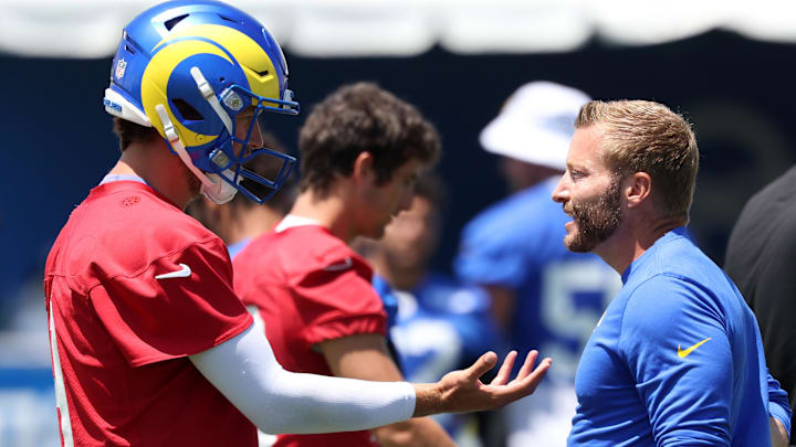 Jul 31, 2024; Los Angeles, CA, USA;  Los Angeles Rams quarterback Matthew Stafford (9) and head coach Sean McVay talk during training camp at Loyola Marymount University. Mandatory Credit: Kiyoshi Mio-Imagn Images