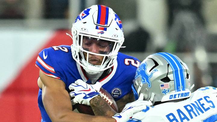 Sep 17, 2026; Orchard Park, New York, USA;  Buffalo Bills wide receiver DJ Moore (2) runs against Detroit Lions linebacker Derrick Barnes (55) during the first half at New Highmark Stadium.  Mandatory Credit: Mark Konezny-Imagn Images