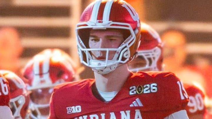 Indiana's Fernando Mendoza (15) and Alberto Mendoza (16) head onto the field as the team is announced before the College Football Playoff National Championship college football game at Hard Rock Stadium in Miami Gardens on Monday, Jan. 19, 2026.