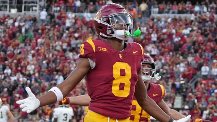 Nov 30, 2024; Los Angeles, California, USA; Southern California Trojans wide receiver Ja'Kobi Lane (8) celebrates after scoring on a 6-yard touchdown reception against the Notre Dame Fighting Irish in the second half at United Airlines Field at Los Angeles Memorial Coliseum.