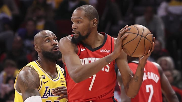 Mar 16, 2026; Houston, Texas, USA; Los Angeles Lakers forward LeBron James (23) defends against Houston Rockets forward Kevin Durant (7) during the fourth quarter at Toyota Center. Mandatory Credit: Troy Taormina-Imagn Images