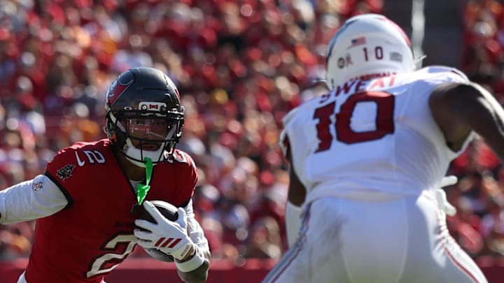 Tampa Bay Buccaneers wide receiver Emeka Egbuka (2) runs against Arizona Cardinals linebacker Josh Sweat (10) Tampa Bay Buccaneers wide receiver Emeka Egbuka (2) runs against Arizona Cardinals linebacker Josh Sweat (10)