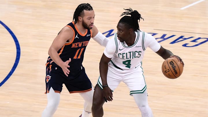 Apr 8, 2025; New York, New York, USA; Boston Celtics guard Jrue Holiday (4) sets the play while being defended by New York Knicks guard Jalen Brunson (11) during the first half at Madison Square Garden. Mandatory Credit: John Jones-Imagn Images