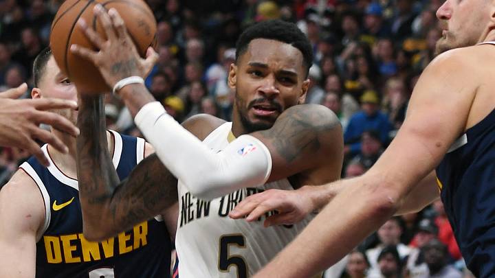 New Orleans Pelicans guard Dejounte Murray (5) drives to the basket against Denver Nuggets center Nikola Jokic (15) during the second half at Ball Arena. Mandatory Credit: Christopher Hanewinckel-Imagn Images