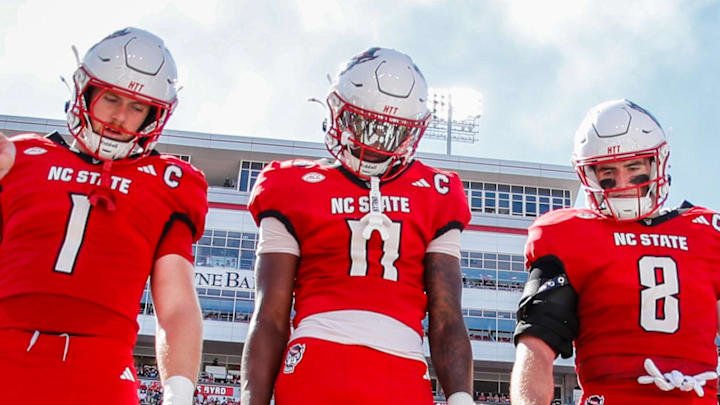 Oct 4, 2025; Raleigh, North Carolina, USA; NC State Wolfpack quarterback CJ Bailey (11), linebacker Caden Fordham (1), wide receiver Keenan Jackson (8) during the coin toss prior to the first half of the game against Campbell Fighting Camels at Carter-Finley Stadium. Mandatory Credit: Jaylynn Nash-Imagn Images Oct 4, 2025; Raleigh, North Carolina, USA; NC State Wolfpack quarterback CJ Bailey (11), linebacker Caden Fordham (1), wide receiver Keenan Jackson (8) during the coin toss prior to the first half of the game against Campbell Fighting Camels at Carter-Finley Stadium. Mandatory Credit: Jaylynn Nash-Imagn Images