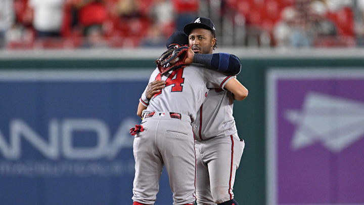 Apr 22, 2026; Washington, District of Columbia, USA;  Atlanta Braves infielder Mauricio Dubon (14) and infielder Ozzie Albies (1) celebrate after defeating the Washington Nationals at Nationals Park. Mandatory Credit: Jamie Sabau-Imagn Images