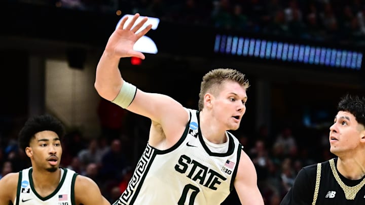 Mar 21, 2025; Cleveland, OH, USA; Bryant University Bulldogs guard Rafael Pinzon (24) shoots the ball defended by Michigan State Spartans forward Jaxon Kohler (0) in the second half during the NCAA Tournament First Round at Rocket Mortgage Fieldhouse. Mandatory Credit: Ken Blaze-Imagn Images