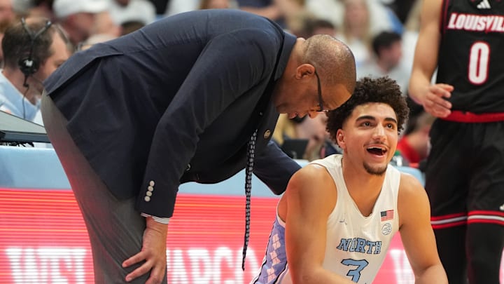 Feb 23, 2026; Chapel Hill, North Carolina, USA; North Carolina Tar Heels head coach Hubert Davis with guard Derek Dixon (3) in the second half at Dean E. Smith Center. Mandatory Credit: Bob Donnan-Imagn Images Feb 23, 2026; Chapel Hill, North Carolina, USA; North Carolina Tar Heels head coach Hubert Davis with guard Derek Dixon (3) in the second half at Dean E. Smith Center. Mandatory Credit: Bob Donnan-Imagn Images
