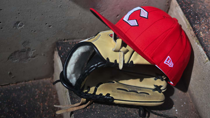 Apr 11, 2026; Cincinnati, Ohio, USA;  A view of an official Cincinnati Reds hat on the dugout steps during the game against the Los Angeles Angels at Great American Ball Park. Mandatory Credit: Aaron Doster-Imagn Images