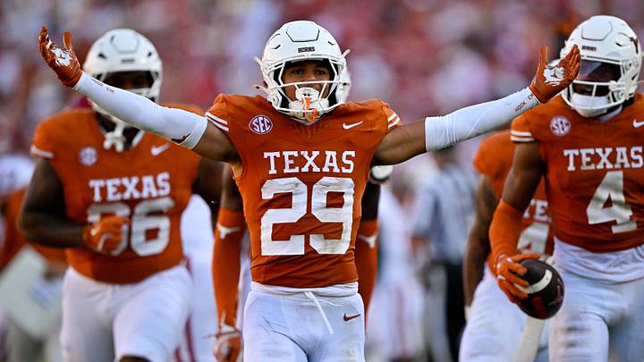 Texas Longhorns defensive back Graceson Littleton (29) celebrates after he intercepts a pass from Oklahoma Sooners quarterback John Mateer (not pictured) during the second half at the Cotton Bowl. Texas Longhorns defensive back Graceson Littleton (29) celebrates after he intercepts a pass from Oklahoma Sooners quarterback John Mateer (not pictured) during the second half at the Cotton Bowl.