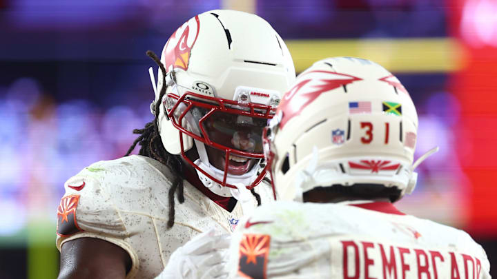 Sep 25, 2025; Glendale, Arizona, USA;  Arizona Cardinals running back Emari Demercado (31) celebrates with wide receiver Marvin Harrison Jr. (18) after scoring a touchdown against the Seattle Seahawks in the fourth quarter at State Farm Stadium. Mandatory Credit: Mark J. Rebilas-Imagn Images