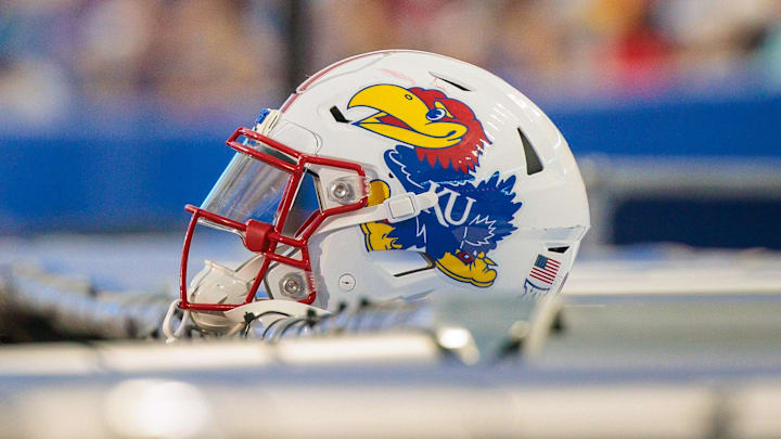 Aug 29, 2025; Lawrence, Kansas, USA; Kansas Jayhawks helmet sits on the side lines during the second half against the Wagner Seahawks at David Booth Kansas Memorial Stadium. Mandatory Credit: William Purnell-Imagn Images