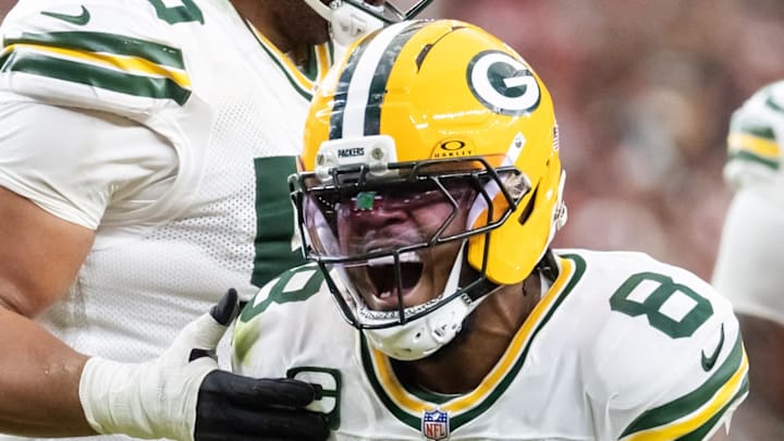 Green Bay Packers running back Josh Jacobs (8) celebrates a play against the Arizona Cardinals on Sunday.