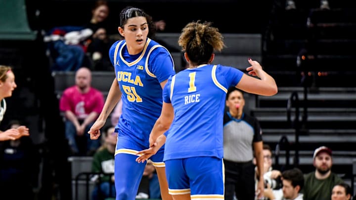 UCLA's Lauren Betts, left, celebrates with Kiki Rice after Rice's 3-pointer against Michigan State during the third quarter on Wednesday, Feb. 11, 2026, at the Breslin Center in East Lansing.