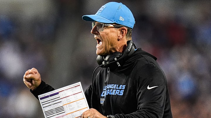 LA Chargers head coach Jim Harbaugh celebrates a touchdown against Detroit Lions during the first half of the Hall of Fame Game at Tom Benson Hall of Fame Stadium in Canton, Ohio on Thursday, July 31, 2025.