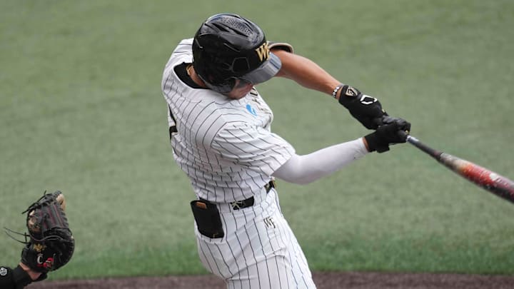 Wake Forest infielder Marek Houston (7) hits the ball during a NCAA regional baseball game between Cincinnati and Wake Forest at Lindsey Nelson Stadium in Knoxville, Tenn., on May 30, 2025.