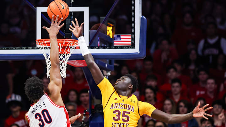 Jan 14, 2026; Tucson, Arizona, USA; Arizona Wildcats forward Tobe Awaka makes a lay up over Arizona State Sun Devils center Massamba Diop (35) during the first half of the game at McKale Memorial Center. Mandatory Credit: Aryanna Frank-Imagn Images