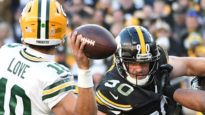 Green Bay Packers quarterback Jordan Love (10)is pressured by Pittsburgh Steelers linebacker T.J. Watt in 2023.