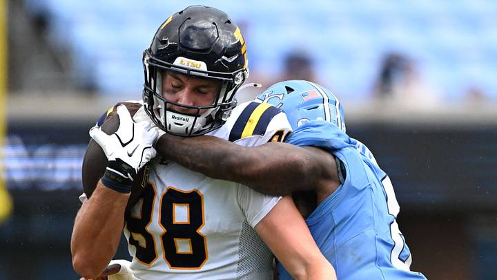 Sep 12, 2026; Chapel Hill, North Carolina, USA; ETSU Buccaneers tight end Charlie Browder (88) with the ball as North Carolina Tar Heels linebacker Jonathan Agumadu (8) defends in the fourth quarter at Kenan Stadium. Mandatory Credit: Bob Donnan-Imagn Images Sep 12, 2026; Chapel Hill, North Carolina, USA; ETSU Buccaneers tight end Charlie Browder (88) with the ball as North Carolina Tar Heels linebacker Jonathan Agumadu (8) defends in the fourth quarter at Kenan Stadium. Mandatory Credit: Bob Donnan-Imagn Images