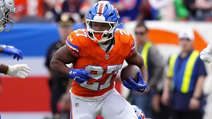 Oct 26, 2025; Denver, Colorado, USA; Denver Broncos running back J.K. Dobbins (27) runs against the Dallas Cowboys in the first half at Empower Field at Mile High. Oct 26, 2025; Denver, Colorado, USA; Denver Broncos running back J.K. Dobbins (27) runs against the Dallas Cowboys in the first half at Empower Field at Mile High.
