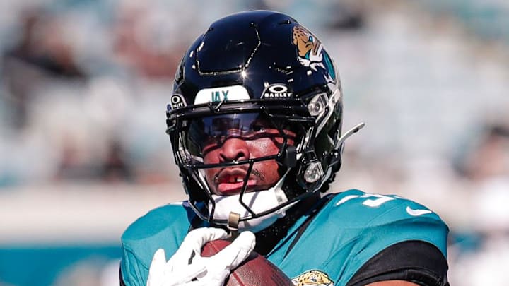 Dec 14, 2025; Jacksonville, Florida, USA;Jacksonville Jaguars running back Bhayshul Tuten (33) warms up during pregame warmups against the New York Jets at EverBank Stadium. Mandatory Credit: Travis Register-Imagn Images
