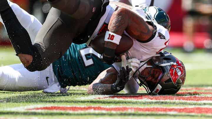 Sep 29, 2024; Tampa, Florida, USA; Tampa Bay Buccaneers wide receiver Trey Palmer (10) catches a pass for a touchdown against the Philadelphia Eagles in the first quarter at Raymond James Stadium. Mandatory Credit: Nathan Ray Seebeck-Imagn Images