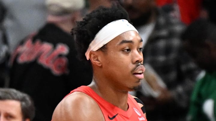 Toronto Raptors forward Scottie Barnes shakes hands with Sacramento Kings forward Precious Achiuwa.