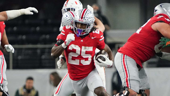 Dec 31, 2025; Arlington, TX, USA; Ohio State Buckeyes running back Bo Jackson (25) runs the ball in the third quarter against the Miami Hurricanes during the 2025 Cotton Bowl and quarterfinal game of the College Football Playoff at AT&T Stadium. Mandatory Credit: Raymond Carlin III-Imagn Images