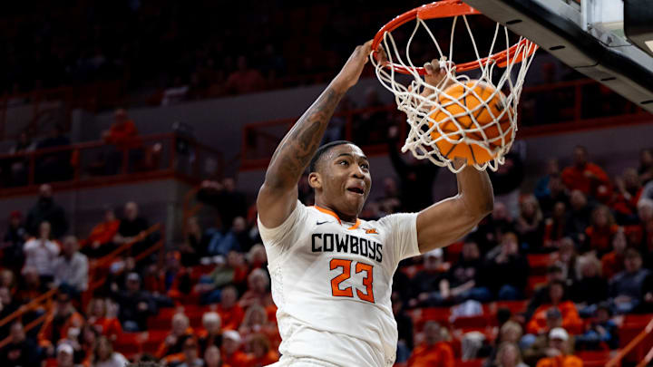 Jan 6, 2024; Stillwater, Okla, USA; Oklahoma State Cowboys center Brandon Garrison (23) slam dunks