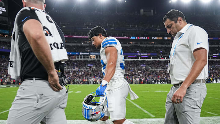 Detroit Lions running back Sione Vaki (33) walks off the field due to an injury during the first half against Baltimore Ravens at M&T Bank Stadium in Baltimore, Md. on Monday, Sept. 22, 2025.
