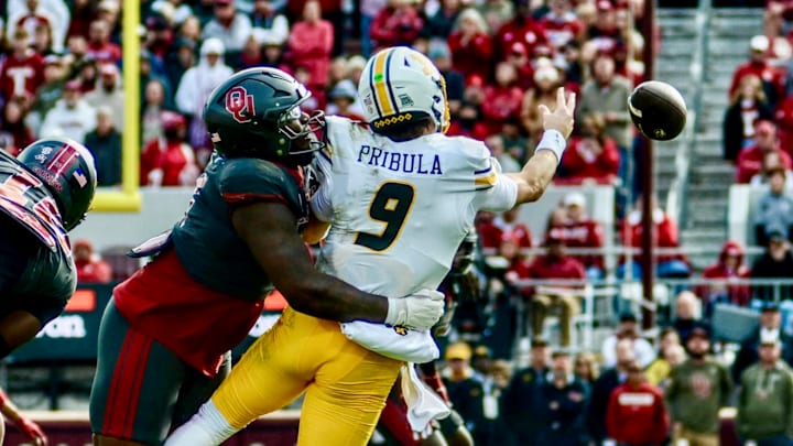 Oklahoma defensive tackle David Stone makes a sack against Missouri. Oklahoma defensive tackle David Stone makes a sack against Missouri.