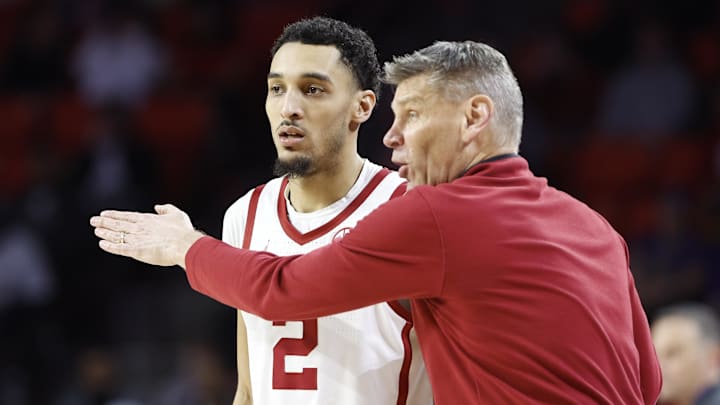 Oklahoma coach Porter Moser and guard Brycen Goodine.