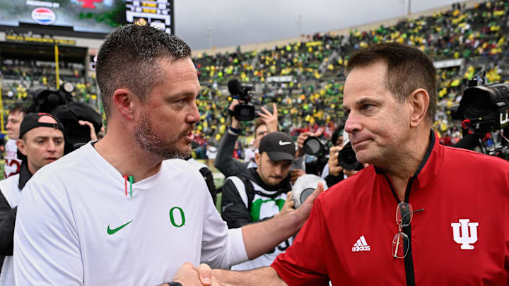 Oct 11, 2025; Eugene, Oregon, USA; Oregon Ducks head coach Dan Lanning shakes hands with Indiana Hoosiers head coach Curt Cignetti after Indiana defeated Oregon by the score of 30-20 at Autzen Stadium. 