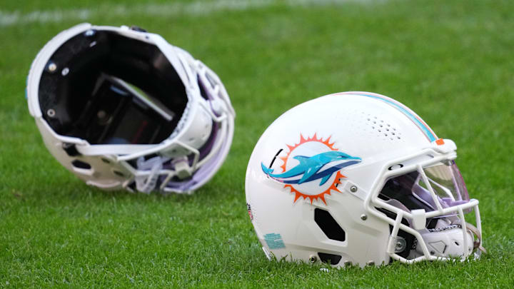 Nov 12, 2025; Madrid, Spain; Miami Dolphins helmets on the field during practice at Estadio Riyadh Air Metropolitano. Mandatory Credit: Kirby Lee-Imagn Images Nov 12, 2025; Madrid, Spain; Miami Dolphins helmets on the field during practice at Estadio Riyadh Air Metropolitano. Mandatory Credit: Kirby Lee-Imagn Images