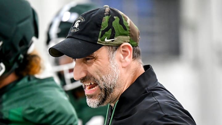 Michigan State's defensive coordinator Joe Rossi encourages players during a drill at spring football practice on Tuesday, April 14, 2026, in East Lansing.