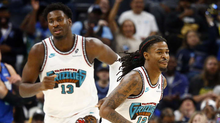 Oct 26, 2024; Memphis, Tennessee, USA; Memphis Grizzlies forward Jaren Jackson Jr. (13) and guard Ja Morant (12) get back on defense during the first half against the Orlando Magic at FedExForum. Mandatory Credit: Petre Thomas-Imagn Images