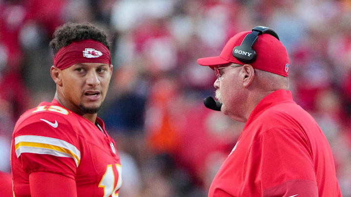 Aug 22, 2025; Kansas City, Missouri, USA; Kansas City Chiefs quarterback Patrick Mahomes (15) talks with head coach Andy Reid after a play against the Chicago Bears during the first half of the game at GEHA Field at Arrowhead Stadium. Mandatory Credit: Denny Medley-Imagn Images
