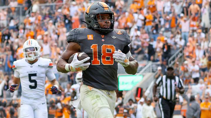 Tennessee Volunteers running back DeSean Bishop (18) runs for a touchdown against the Auburn Tigers during the second half at Neyland Stadium. Tennessee Volunteers running back DeSean Bishop (18) runs for a touchdown against the Auburn Tigers during the second half at Neyland Stadium.