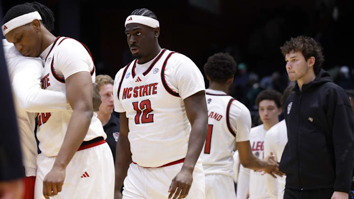 Mar 17, 2026; Dayton, OH, USA; NC State Wolfpack center Scottie Ebube (12) reacts after being defeated by Texas Longhorns during a first four game of the men's 2026 NCAA Tournament at University of Dayton Arena. Mandatory Credit: Rick Osentoski-Imagn Images