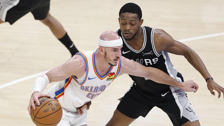 May 26, 2026; Oklahoma City, Oklahoma, USA; Oklahoma City Thunder guard Alex Caruso (9) drives against San Antonio Spurs guard De'aaron Fox (4) during the second quarter in game five of the western conference finals for the 2026 NBA playoffs at Paycom Center. Mandatory Credit: Alonzo Adams-Imagn Images May 26, 2026; Oklahoma City, Oklahoma, USA; Oklahoma City Thunder guard Alex Caruso (9) drives against San Antonio Spurs guard De'aaron Fox (4) during the second quarter in game five of the western conference finals for the 2026 NBA playoffs at Paycom Center. Mandatory Credit: Alonzo Adams-Imagn Images