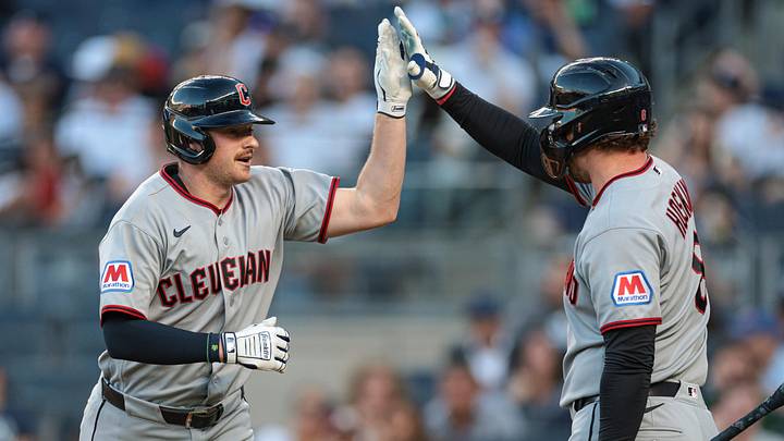 Jun 3, 2026; Bronx, New York, USA;  Cleveland Guardians first baseman Kyle Manzardo (9) celebrates with first baseman Rhys Hoskins (8) after hitting a solo home run during the second inning against the New York Yankees at Yankee Stadium. Mandatory Credit: Vincent Carchietta-Imagn Images