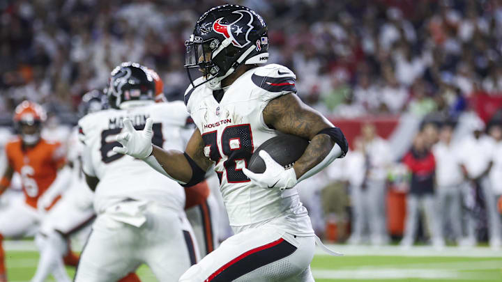 Sep 15, 2024; Houston, Texas, USA; Houston Texans running back Joe Mixon (28) runs with the ball during the third quarter against the Chicago Bears at NRG Stadium. Mandatory Credit: Troy Taormina-Imagn Images