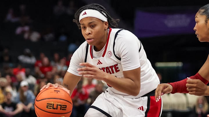 Nov 9, 2025; Charlotte, North Carolina, USA;  NC State Wolfpack guard Zoe Brooks (35) drives the ball against the Southern California Trojans during the second quarter of the Ally Tipoff game at Spectrum Center. Mandatory Credit: Cory Knowlton-Imagn Images