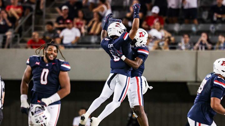 Sep 12, 2025; Tucson, Arizona, USA; Arizona Wildcats defensive back Jay’Vion Cole (8) celebrates with teammate during the third quarter of the game against the Kansas State Wildcats at Arizona Stadium. Mandatory Credit: Aryanna Frank-Imagn Images