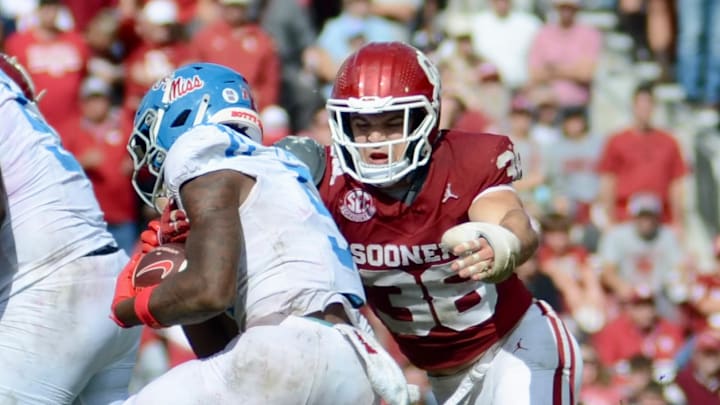 Oklahoma linebacker Owen Heinecke attempts to tackle Ole Miss' Kewan Lacy.