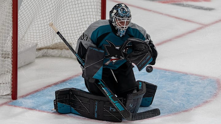 March 1, 2026; San Jose, California, USA; San Jose Sharks goaltender Alex Nedeljkovic (33) makes a save against the Winnipeg Jets during the third period at SAP Center at San Jose. Mandatory Credit: Neville E. Guard-Imagn Images