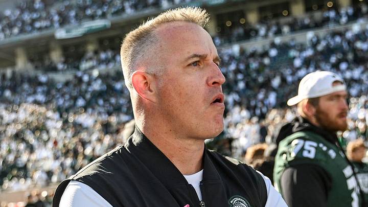 Michigan State’s head coach Pat Fitzgerald, right, leaves the field after shaking hands with Northwestern’s head coach David Braun, left, after the game on Saturday, Oct. 17, 2026, at Spartan Stadium in East Lansing.