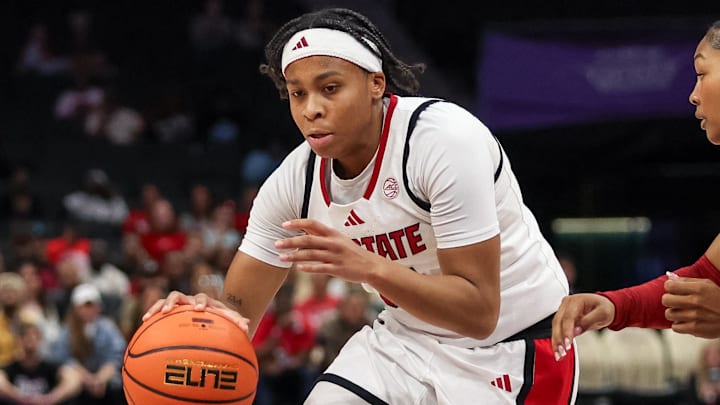 Nov 9, 2025; Charlotte, North Carolina, USA;  NC State Wolfpack guard Zoe Brooks (35) drives the ball against the Southern California Trojans during the second quarter of the Ally Tipoff game at Spectrum Center. Mandatory Credit: Cory Knowlton-Imagn Images